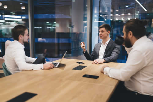 IT teams in a partnership meeting